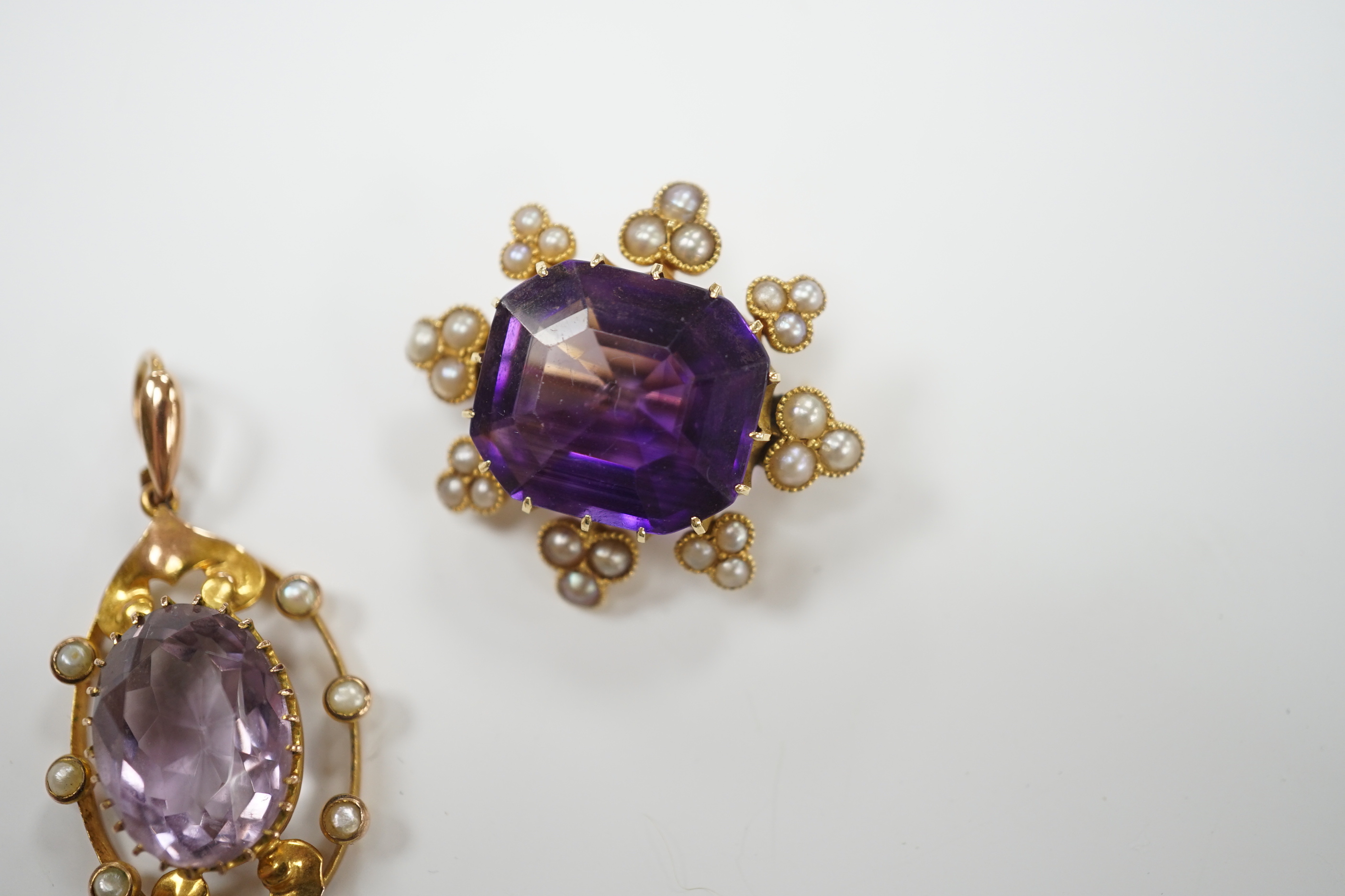 An early 20th century yellow metal, amethyst and seed pearl set brooch, 26mm and a similar pendant, gross weight 9.9 grams.